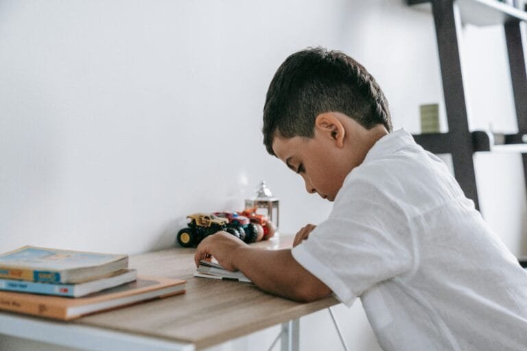 child studying at a desk